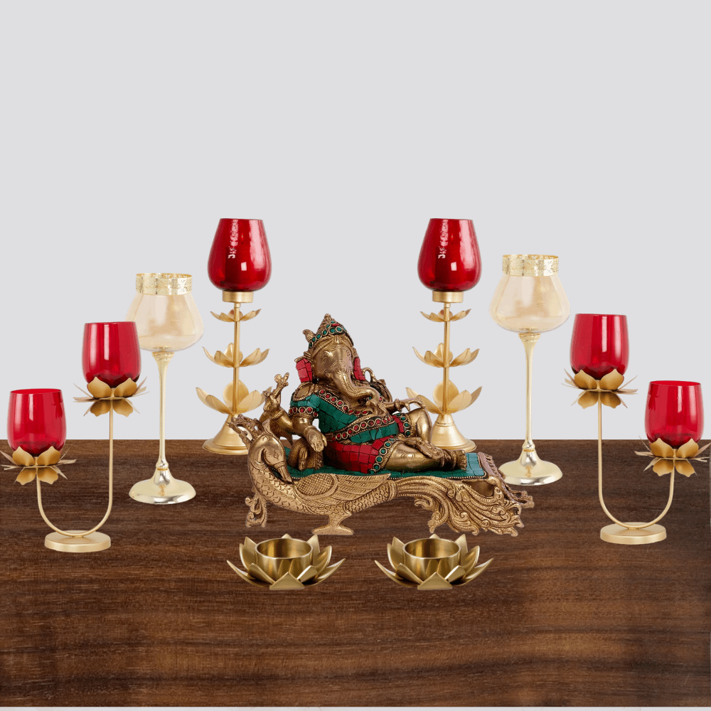traditional diwali decoration vignette in red and gold colours with tea lights and Ganesha statue