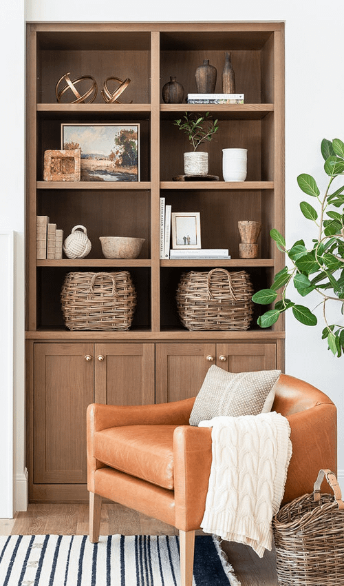 functional shelf styling with baskets and bowls as catch-alls