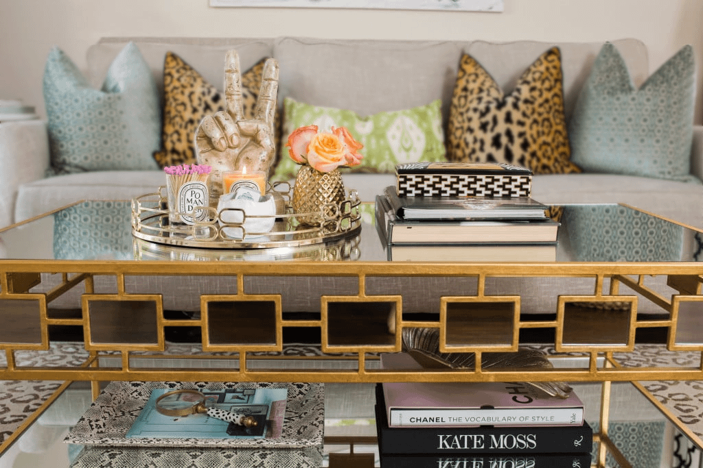 A coffee table styled aesthetically and placed in a living room