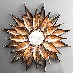 Sunflower shaped mirror placed to enhance wall decor