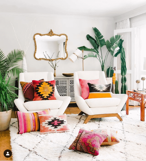 boho room with textured kilim cushions and vintage rug